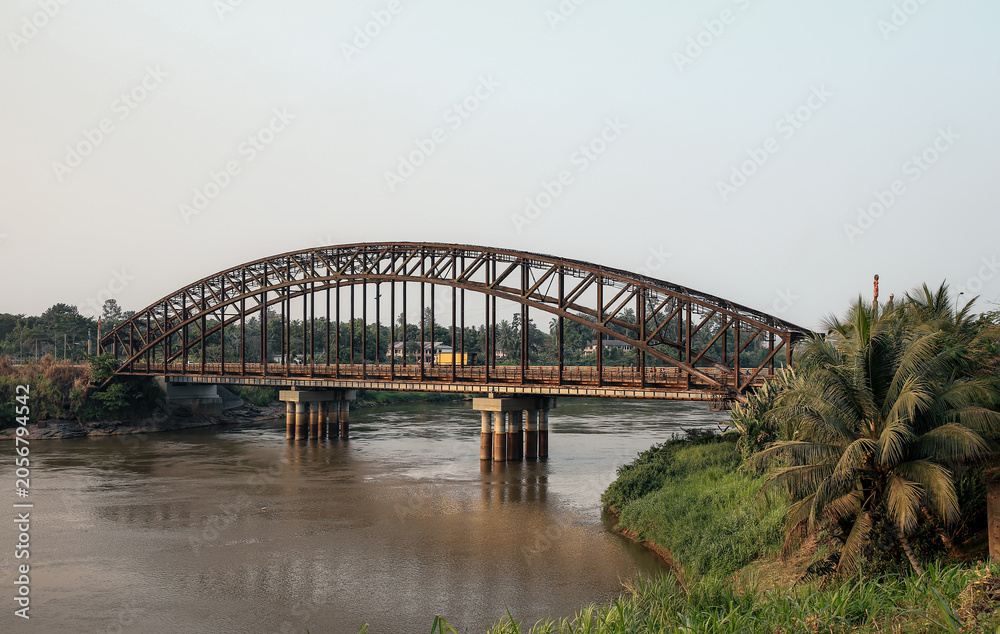 Fototapeta premium The historic German Bridge spanning the Sanaga River in Edea, Cameroon, built during the German colonial period