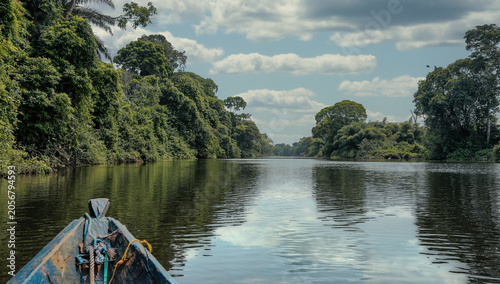 Photos View from a traditional wooden canoe traveling along a remote rainforest river in southern Cameroon on the way to a Bagyeli indigenous community