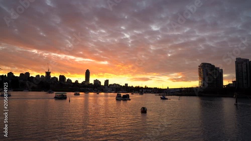 Commuter Ferries Sunset Vancouver 4K UHD. Commuter ferries crisscross in False Creek at sunset. 4K, UHD. 
