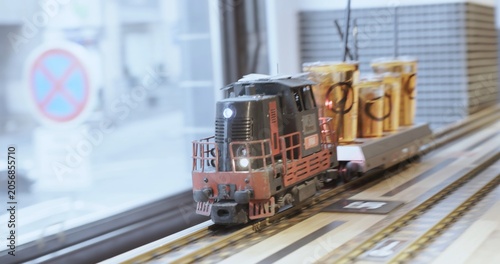 Model train delivering multiple beers on miniature railway