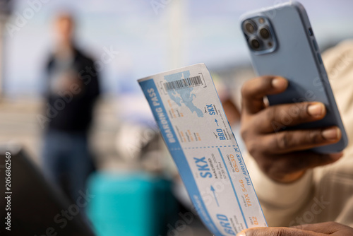 Tableau sur toile Scanning boarding pass code, close up, black guy with flexible career, work anywhere concept of a digital nomad, Remote worker with location independent lifestyle and mobility freedom