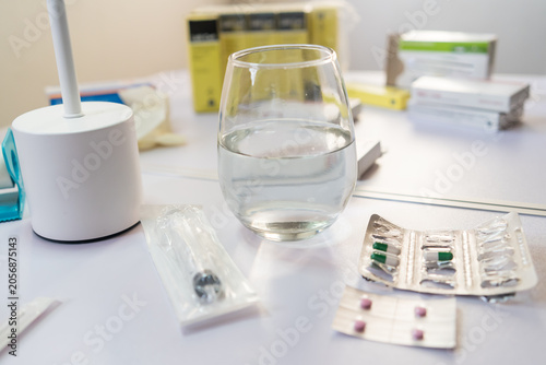 Medical supplies and medication on a white table, ready for use