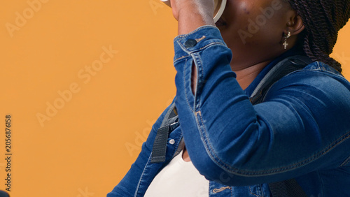 Quadro em tela Female courier riding bicycle while sipping coffee before starting hectic delivery service job, with healthy woman unwinds following on-demand product deliveries