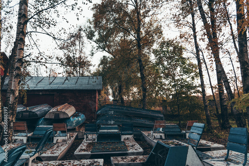 фотографія Pleasure boats are turned upside down, ships are stored in park in winter