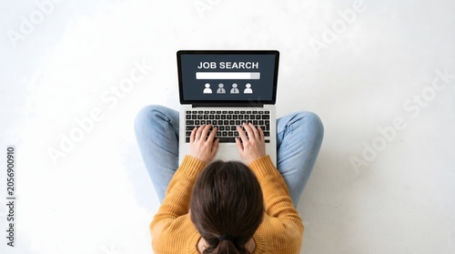 Person Searching for Job on Laptop Top View
