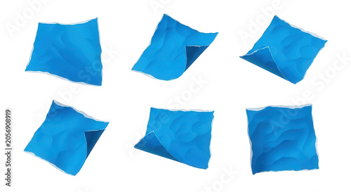 isolated torn blue paper pieces scattered on a white background abstract concepts for design use