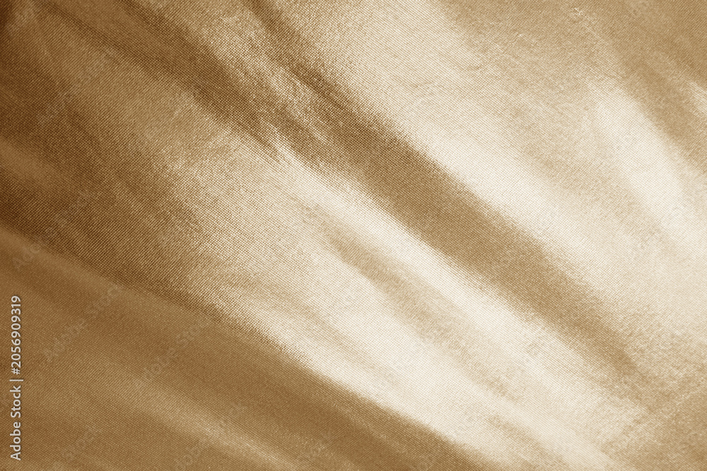 Fototapeta premium Abstract light pale muted gold golden beige white fabric background. Elegant luxury textile backdrop. Shiny glossy. Gradient. Copy space.Cosmetic jewelry product design.Empty blank minimal template ad