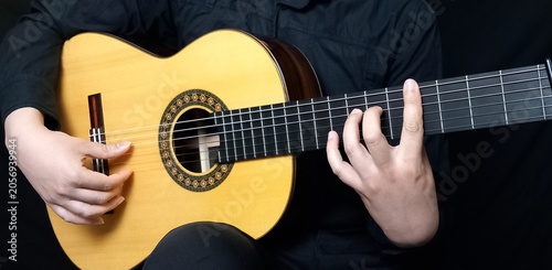 A flamenco teacher play guitar