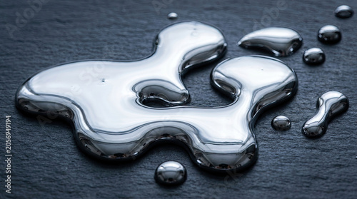 Liquid metal gallium pooling on dark surface creates striking visual effect