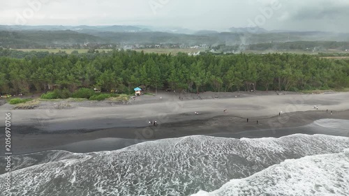 Pantai Cemara Beach Aerial Zoom Out Shot With Ocean Waves in Cianjur Indonesia