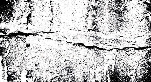 Contrast black and white texture of a cracked concrete wall showing deep fissures and rough weathered surface details in monochrome