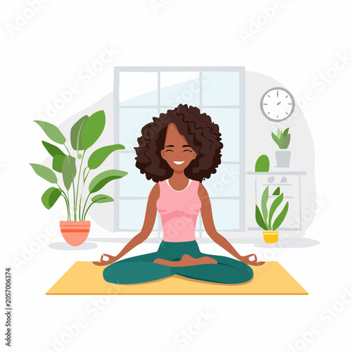 African American woman meditating in lotus pose on a yoga mat