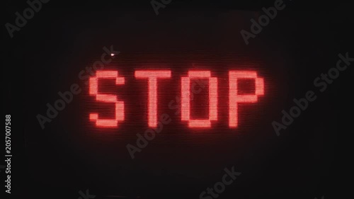Red pixelated stop text with heavy analog glitch and vhs noise