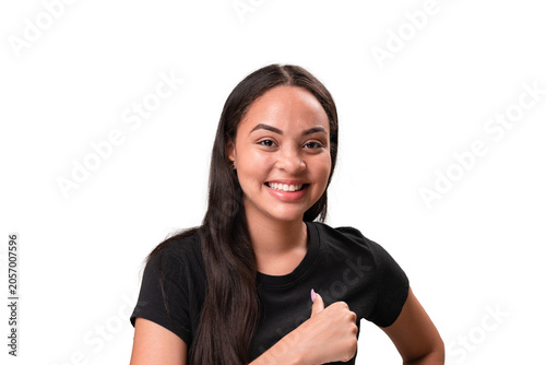 Happy young latina woman smiling and showing thumbs up gesture isolated on white background.