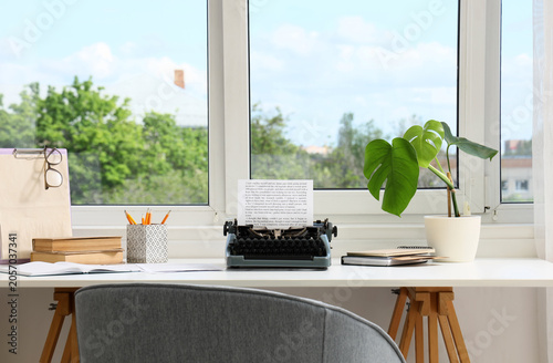 Vintage typewriter with pap...