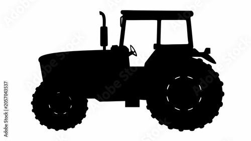 Black silhouette of a farm tractor
