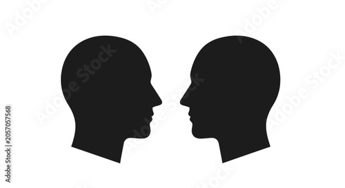 Two black human head silhouettes facing each other on white