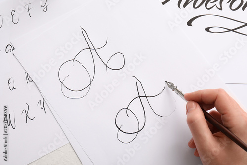 Foto Hand drawing calligraphy letter a with dip pen on white paper, creative art and