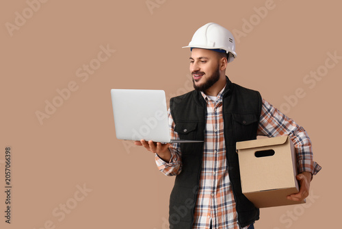 Smiling male engineer in ha...