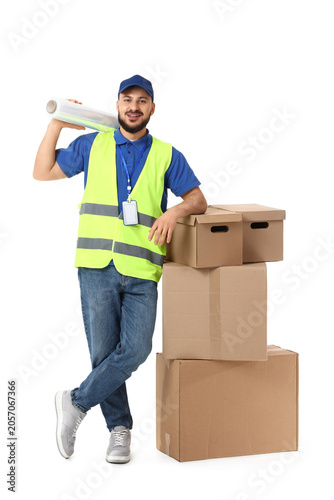 Smiling delivery man in saf...