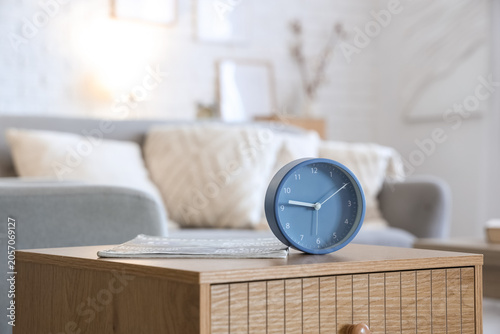 Alarm clock and magazine on...