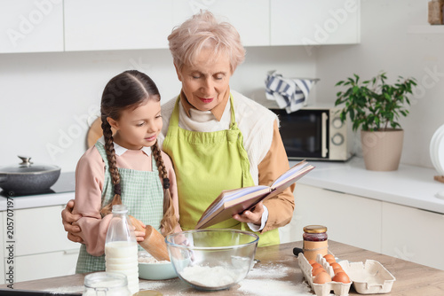 Cute little girl and her gr...