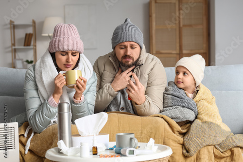 Ill family in winter clothe...