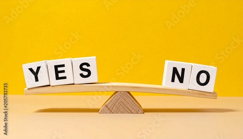 Wooden balance scale cubes spelling yes no decision concept