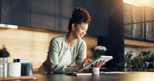 Εκτύπωση καμβά Finance, woman and happy with tablet in kitchen for insurance payout, loyalty reward or review