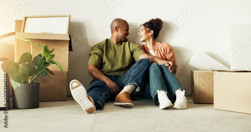 Tableau sur toile Couple, relax and moving in new home with boxes, property investment and happy for mortgage loan