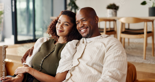 Cuadro en lienzo Happy, couple and relax in living room for watching tv, movie entertainment and love bonding together