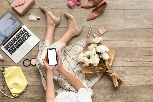 Woman relaxing on floor wit...