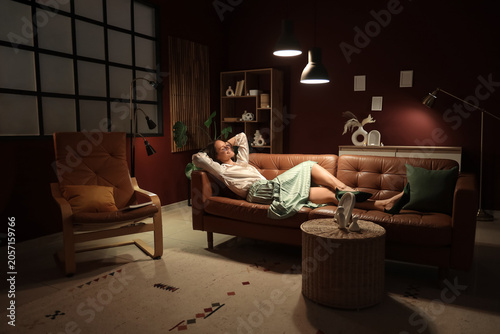 Relaxed woman lounging on a...