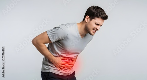Individual experiencing sharp abdominal pain with red highlighted area. Appendicitis or digestive issue concept. Man pressing his hands against his aching side in distress.
