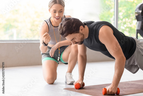 Personal trainer motivating...