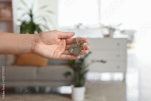 Female hand with key from h...