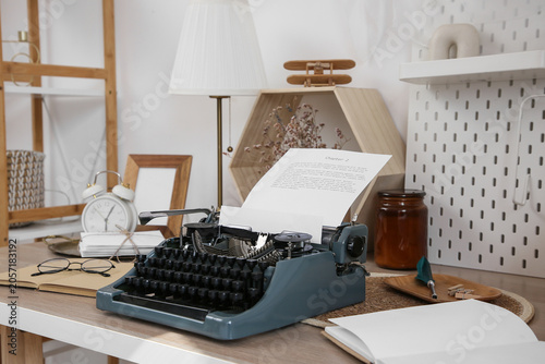 Photography Vintage typewriter with chapter 2 document on wooden desk, creative writing and