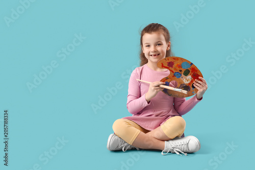 Happy little girl holding a...