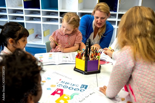 Children learning with teacher guidance.