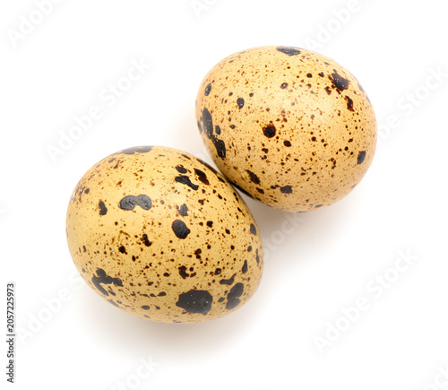 Fresh quail eggs on white b...