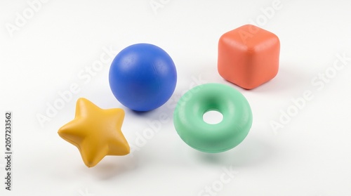 Colorful rubber shapes including star, sphere, cube, and donut.
