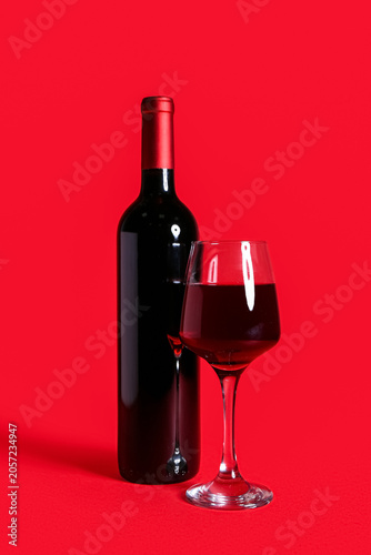Bottle and glass of wine on...
