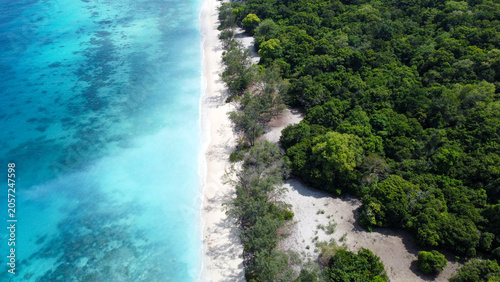 Photography Aerial view of coastal landscape on uninhabited tropical Jaco Island in Timor-Le