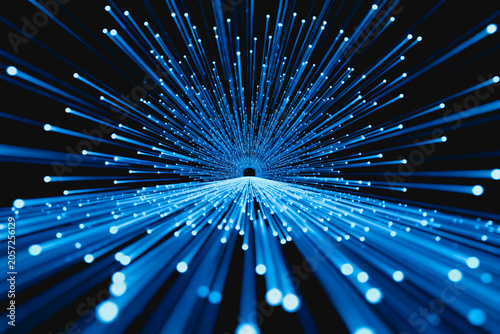 A 3D rendered visual of glowing cyan fiber optic light streams radiating rapidly from a distant dark point, representing high-speed digital data transmission.