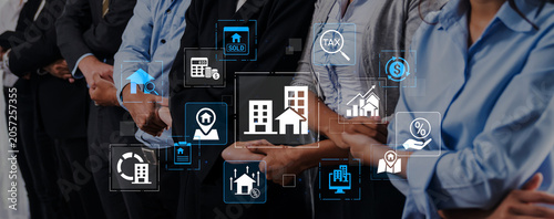 Φωτογραφία Group of Business Professionals Engaged in Real Estate Discussion with Digital Icons Representing Property Transactions, Finances, and Market Trends
