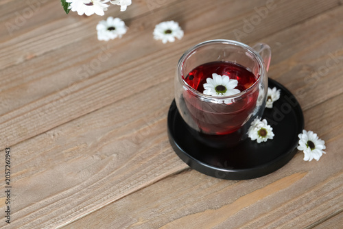 Herbal tea with white daisy...
