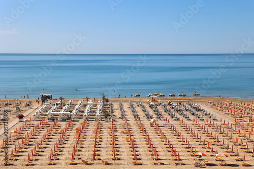 Rows of beach umbrellas and...
