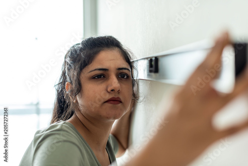 Photography Focused woman using level tool