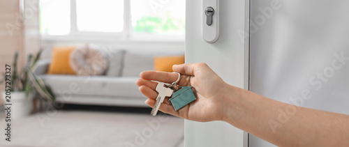 Female hand with key from h...