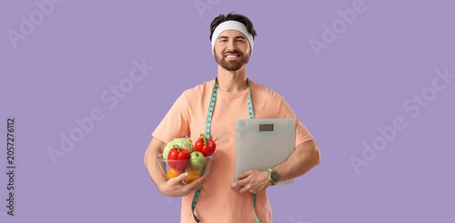 Smiling man with headband h...